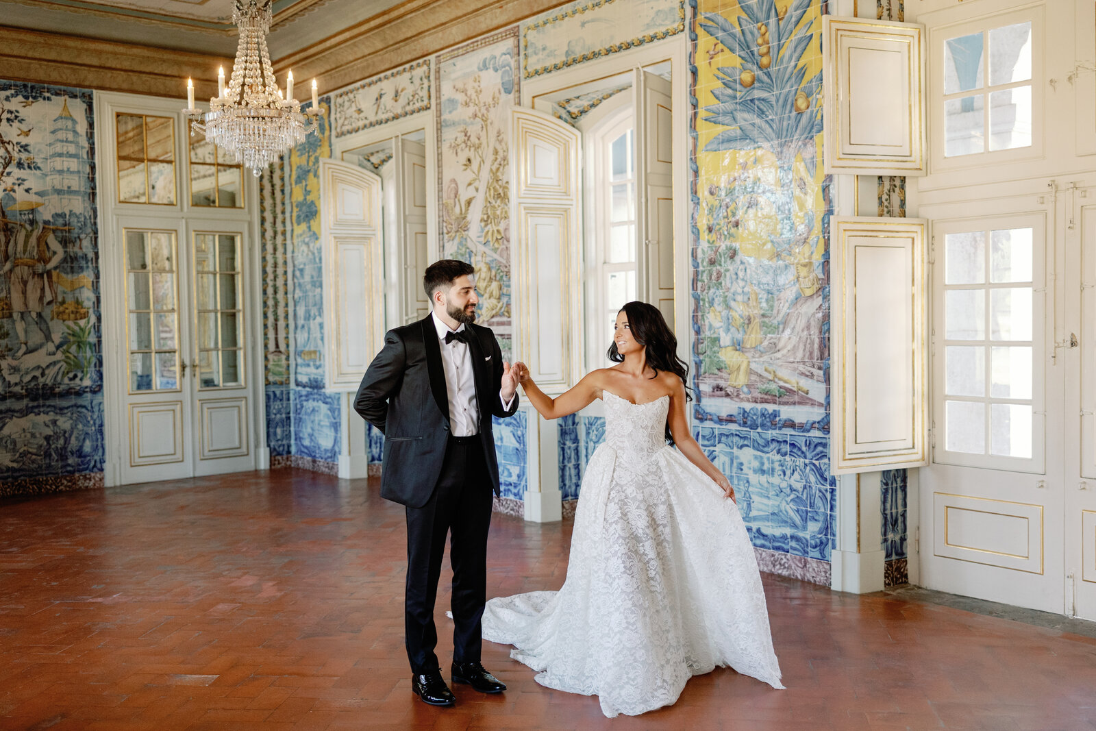 Bride and groom dancing in the tiled palace room