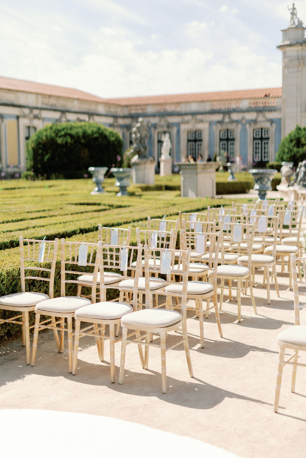 White and blue floral arrangement detail along the aisle