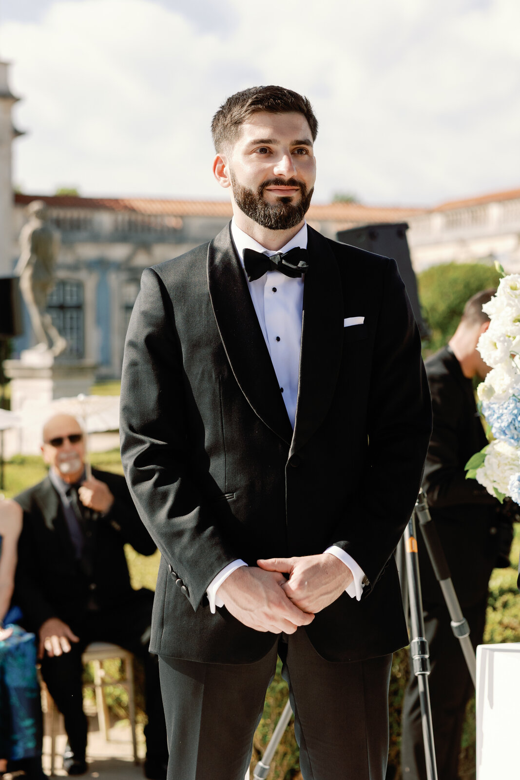 Solo portrait of the groom smiling before the ceremony