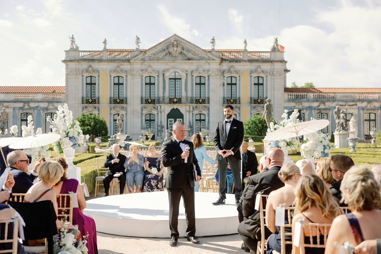 Groom walking down the aisle greeting guests