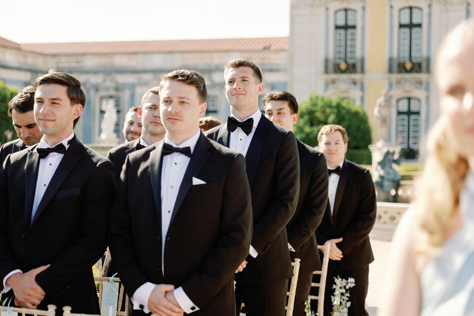 Groomsmen standing in a row at the altar