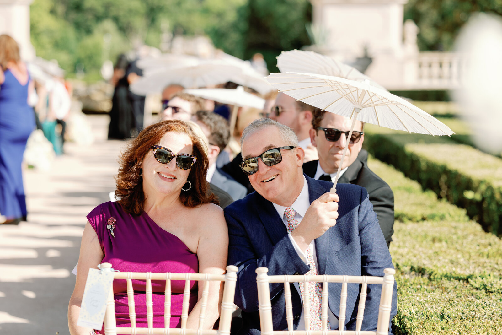 Guests mingling in the garden before the ceremony