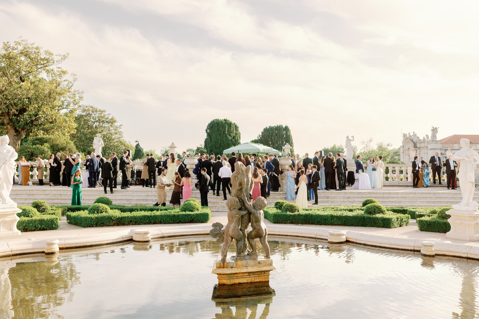 Aerial view of guests gathered near the garden fountain