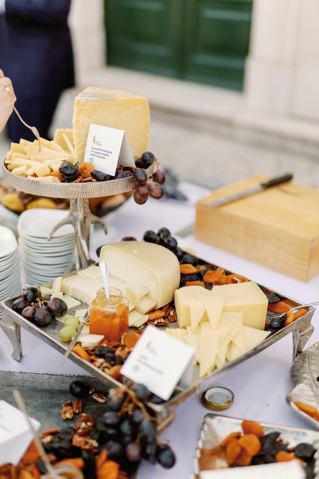 Portuguese cheese display with grapes, dried fruit, and honey