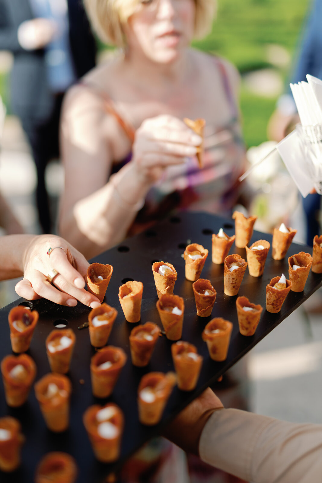 Passed hors d'oeuvres cones on a black serving tray