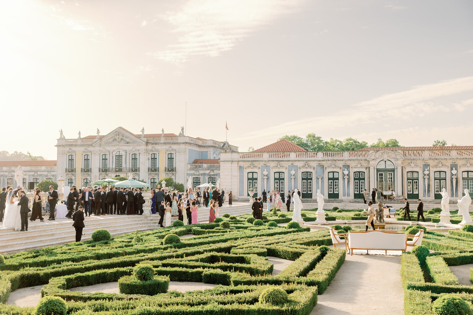 Guests gathered on the terrace steps beside the palace