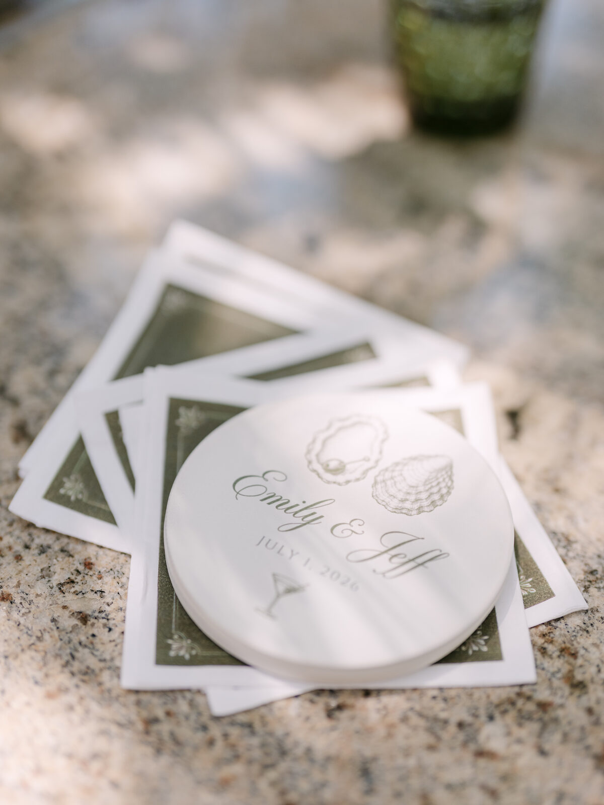 Detail shot of custom coasters printed with the couple's names and date