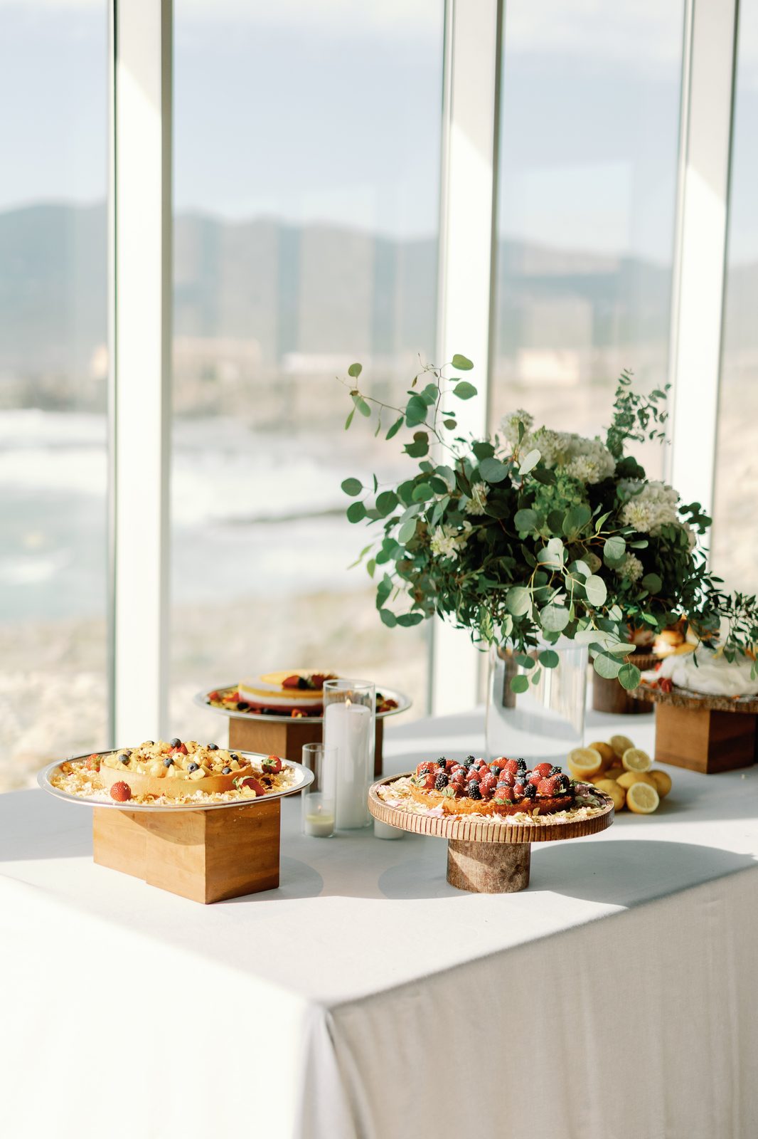 Dessert table with fruit tarts and cakes