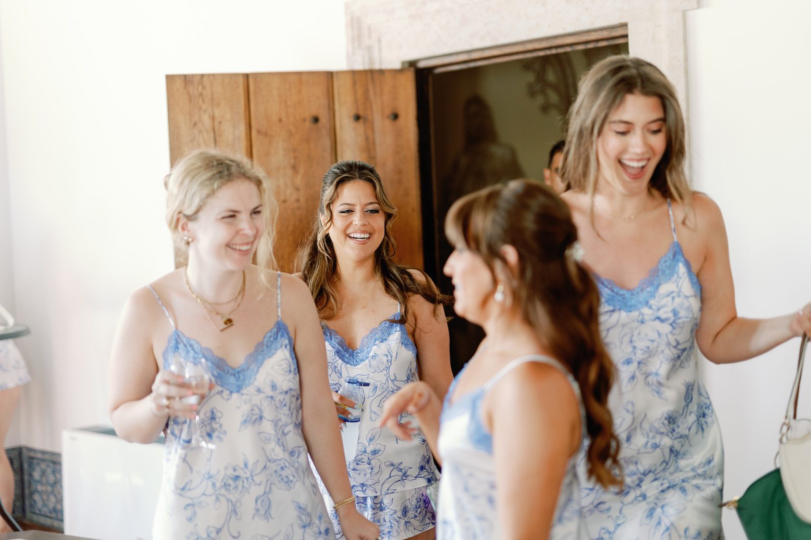 Bridesmaids sharing a candid toast together
