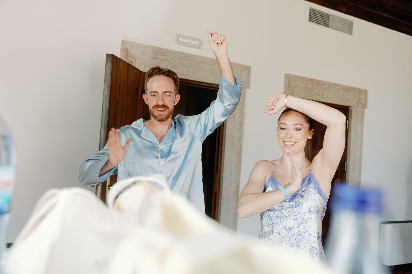 Bride and groom sharing a playful candid moment