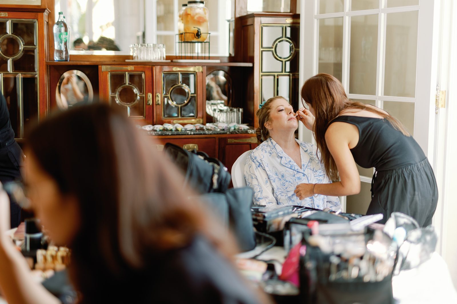 Guest having her makeup applied