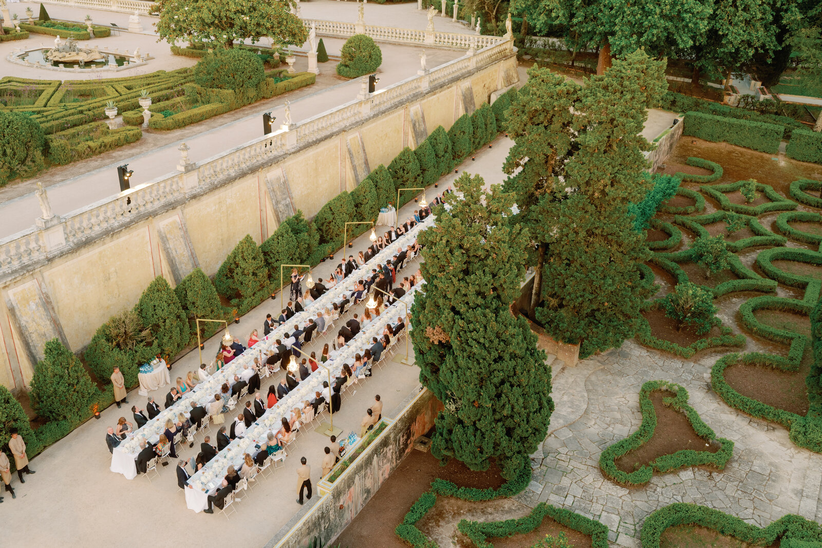Aerial view of the garden maze and reception tables at dusk