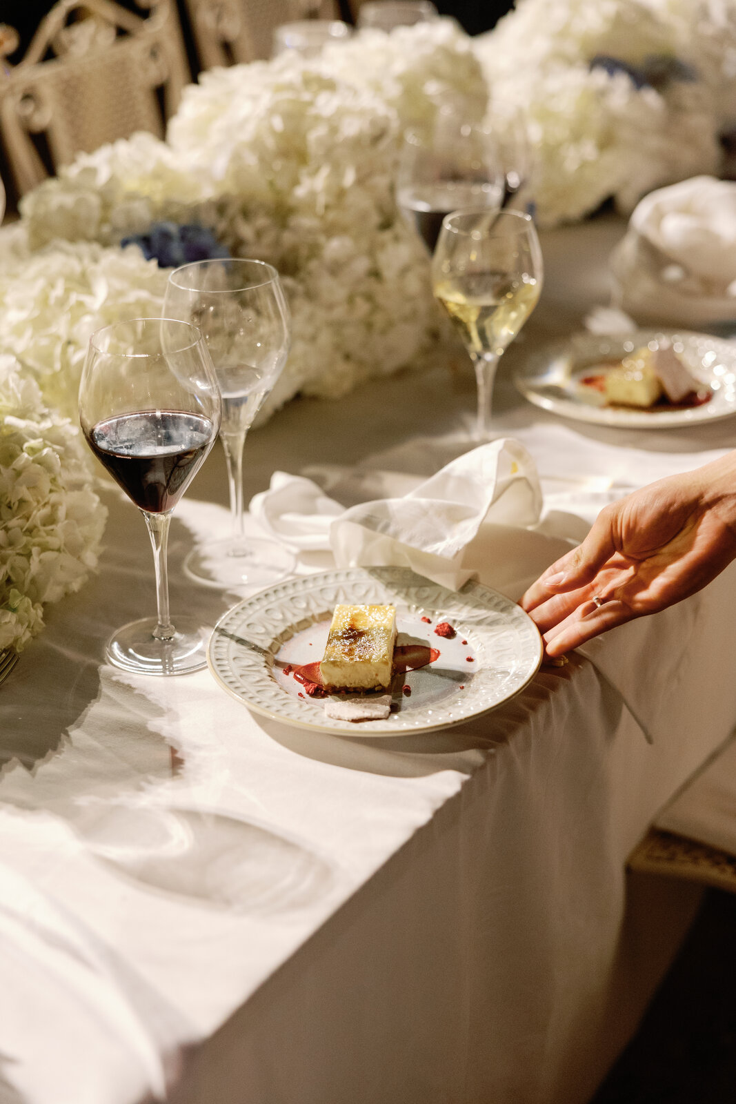 Dessert course with crème brûlée and wine glasses