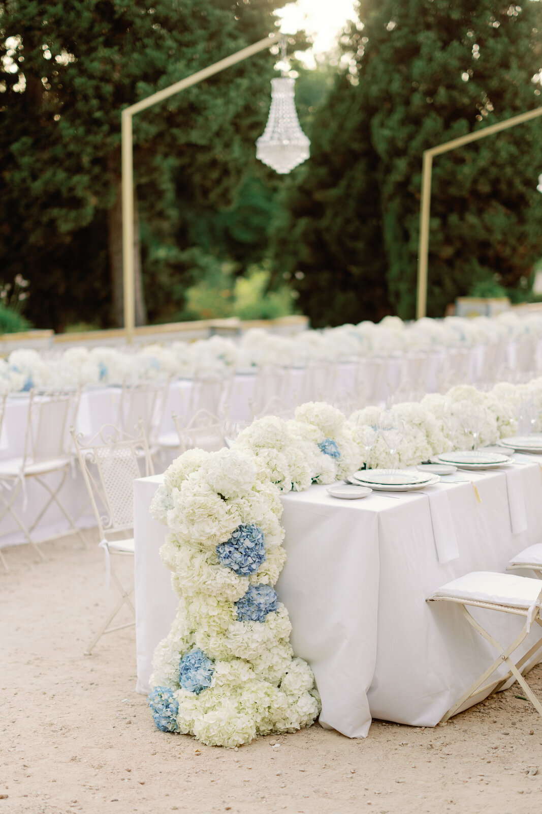 Close-up of a hanging crystal chandelier above the tables