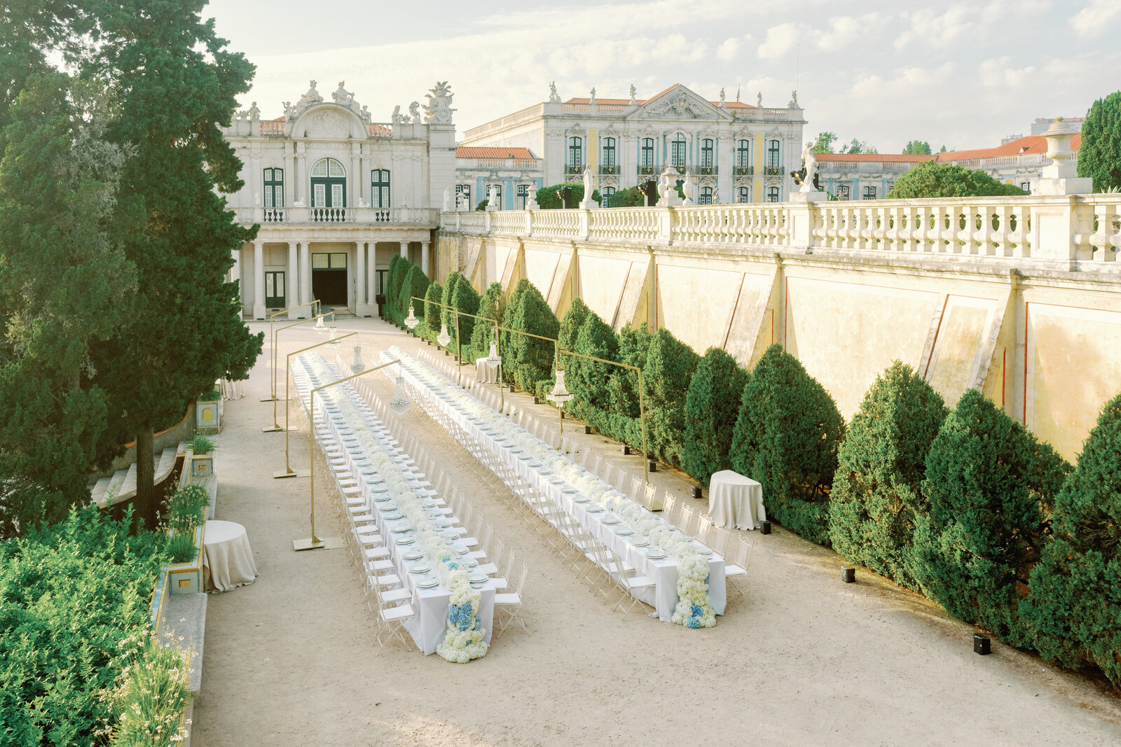 Wide view of the reception tables leading toward the palace
