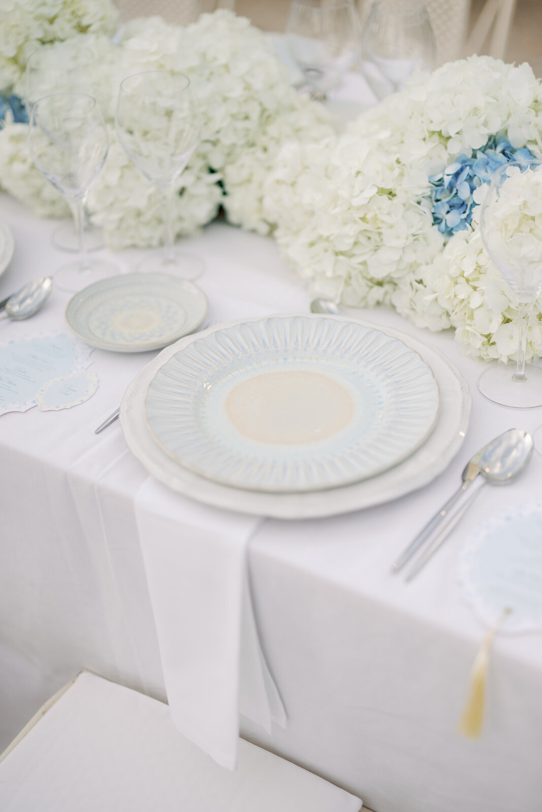 Close-up of blue and gold patterned place setting