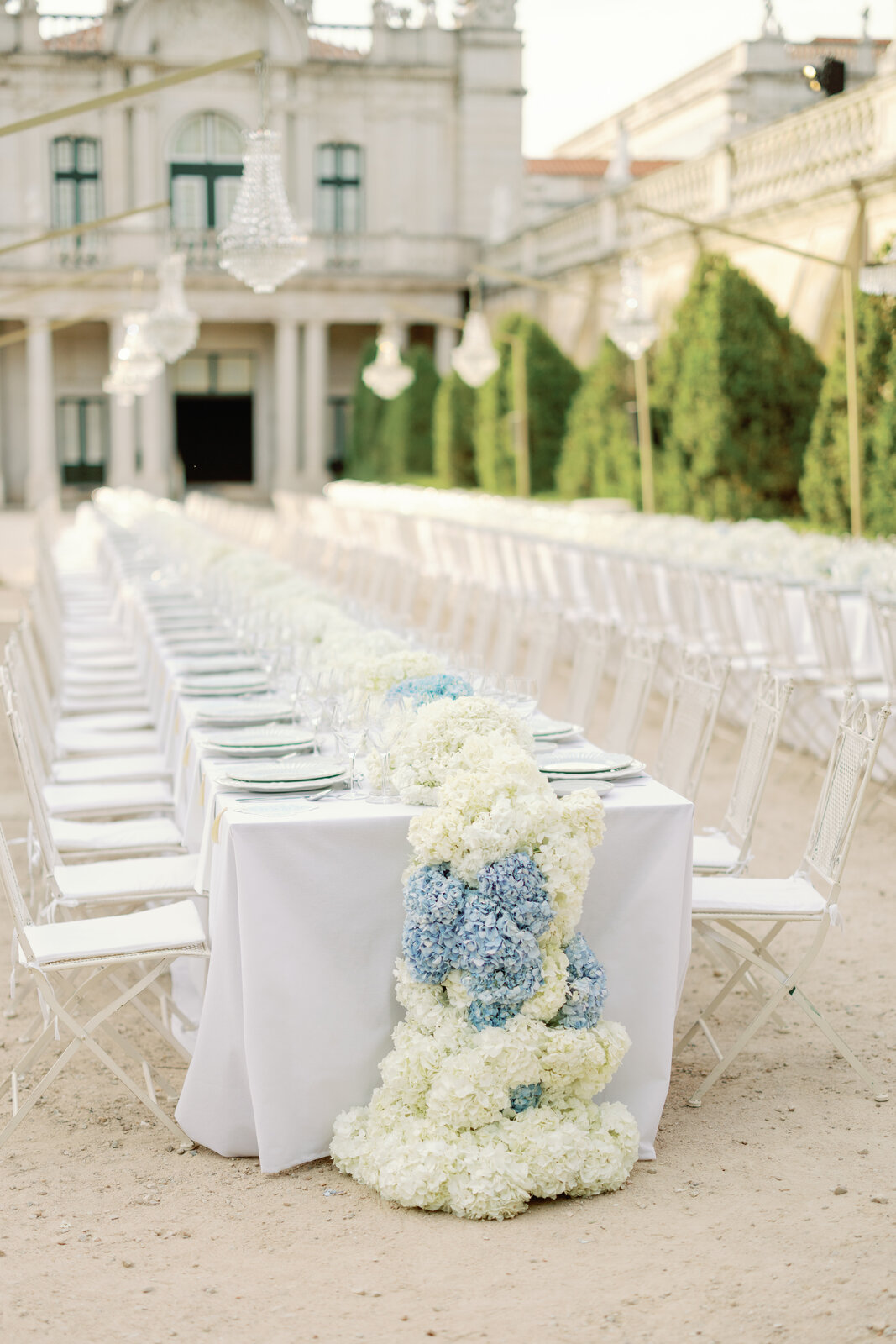 Table setting with chandeliers in the background