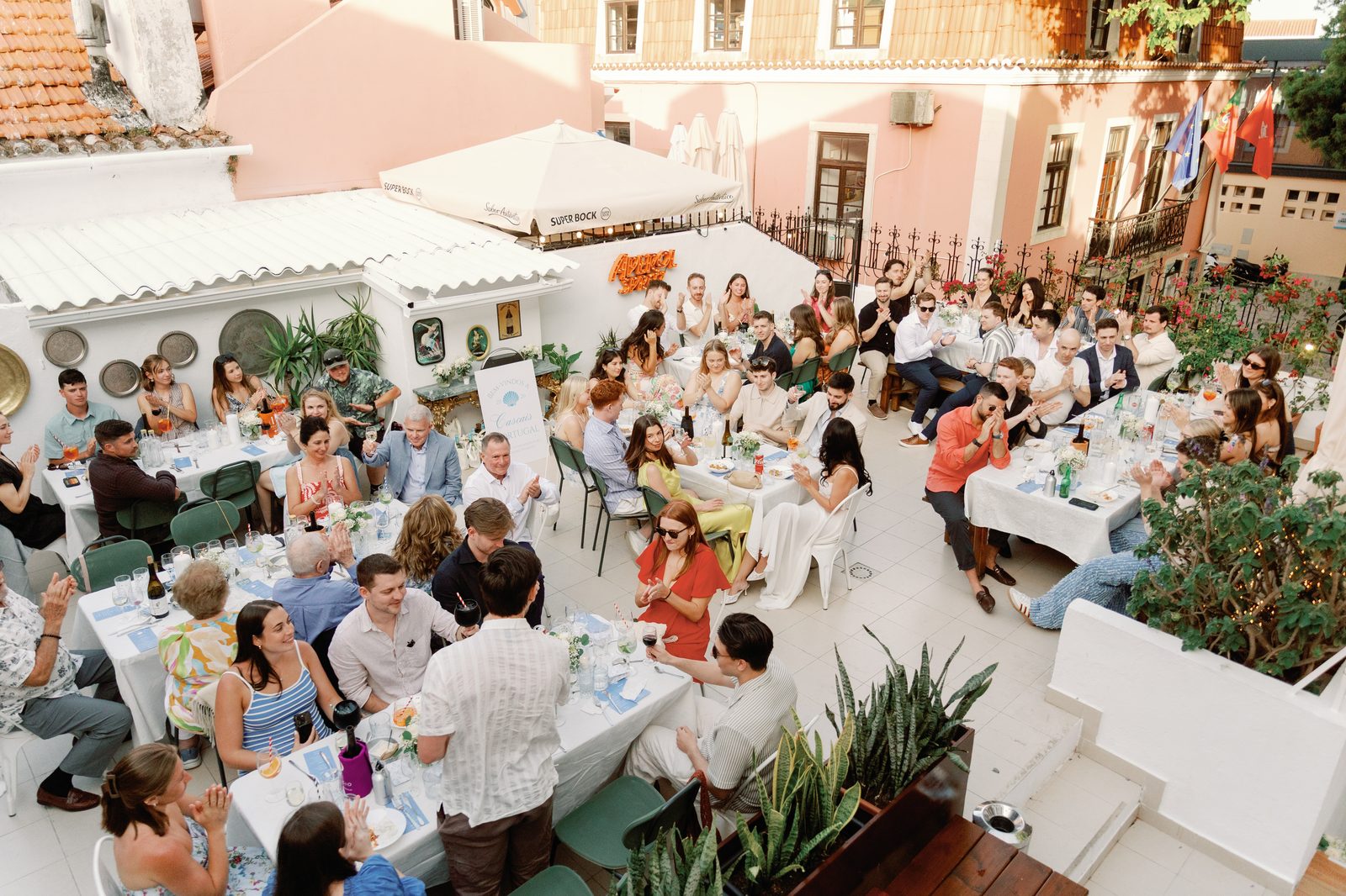 Aerial view of guests applauding during a toast