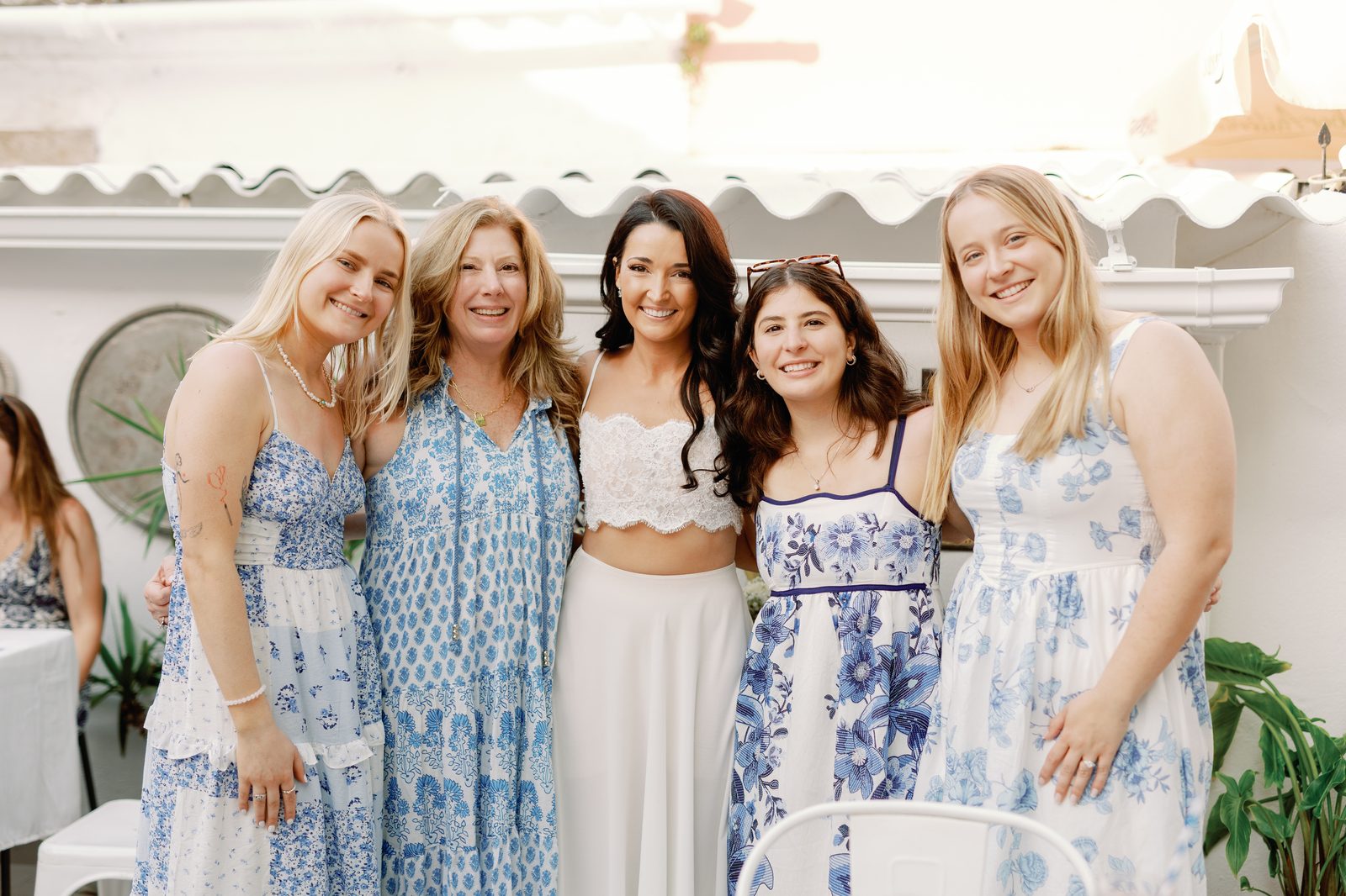 Bride posing with friends and family