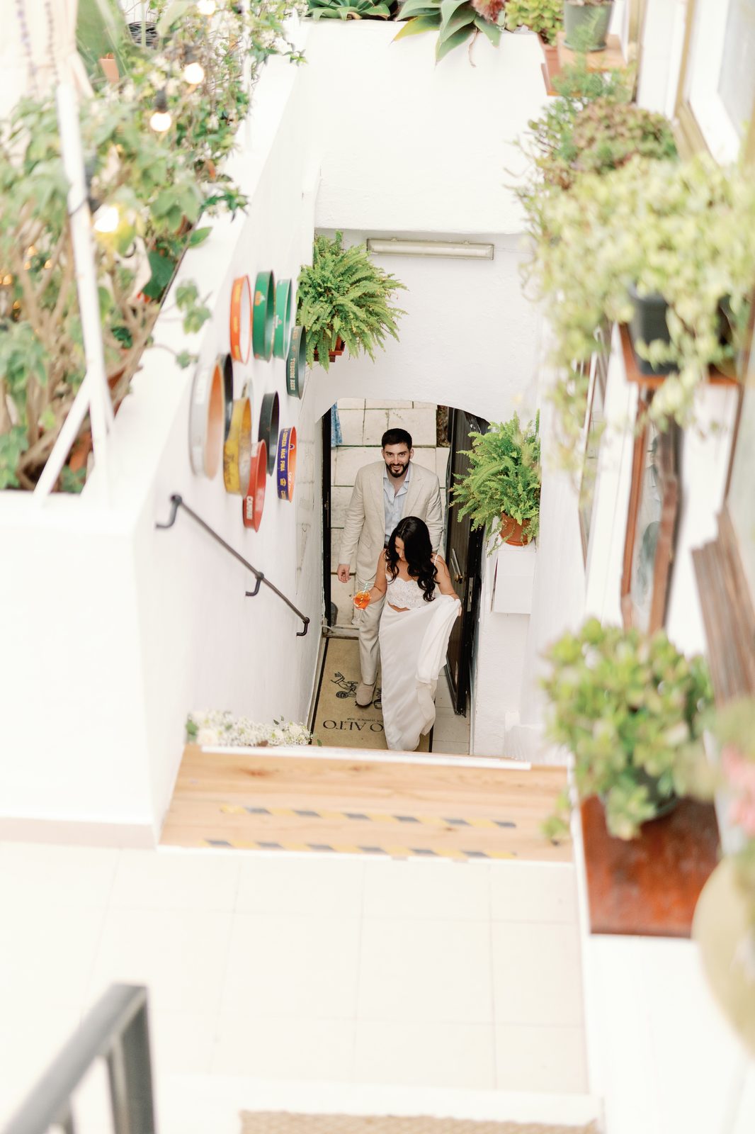 Bride and groom descending the staircase to Copo Alto