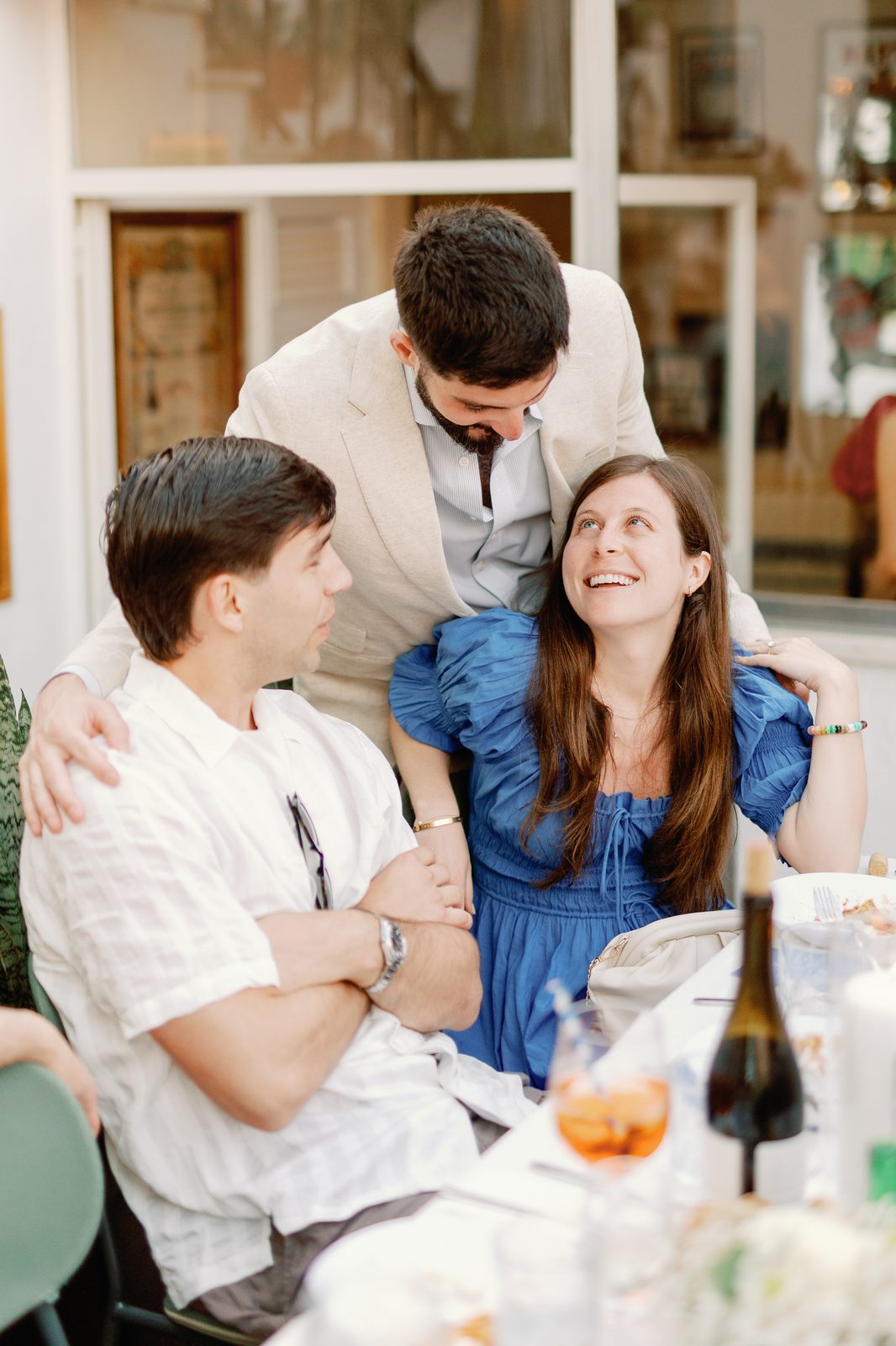 Friends sharing a candid moment at the table