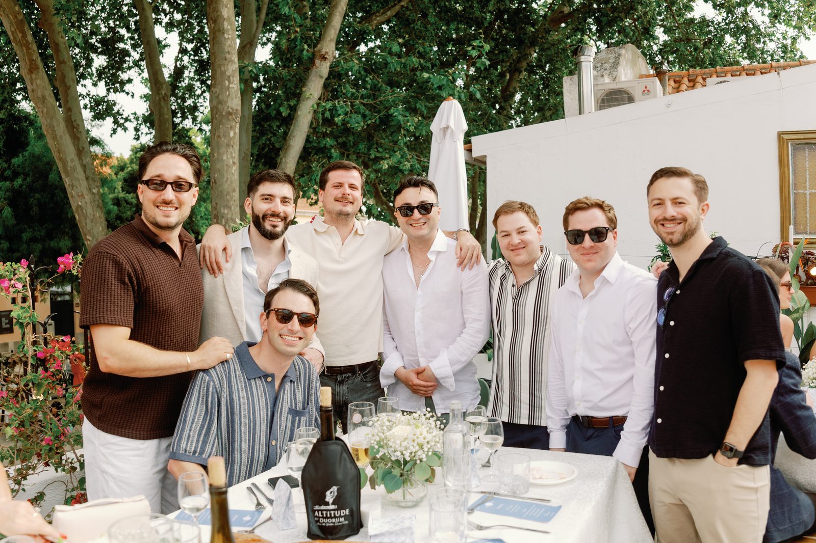 Groomsmen posing together at the rehearsal dinner