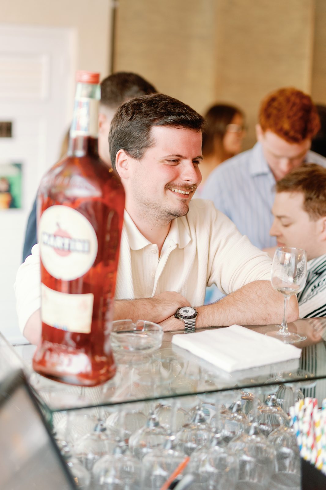 Guest smiling near the bar