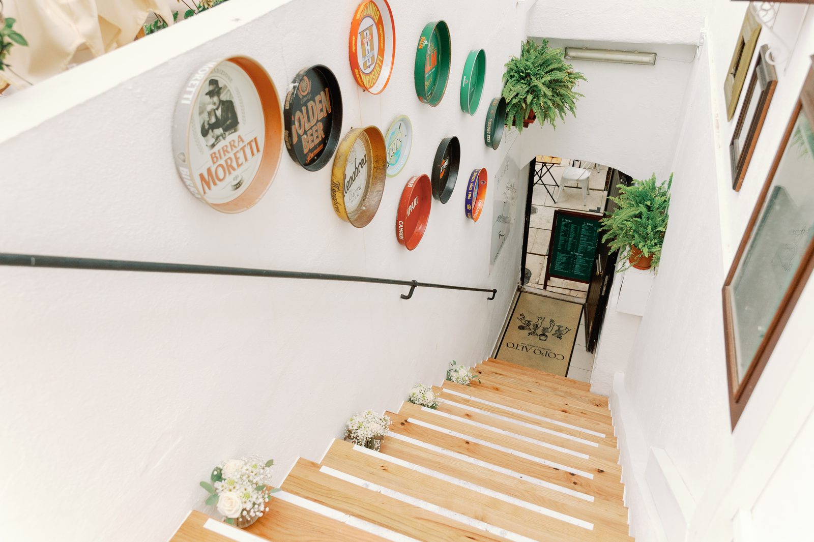 View down the staircase entrance to Copo Alto, decorated with flowers