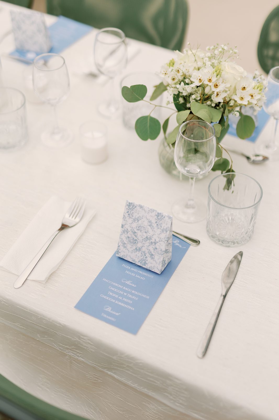 Table setting detail with florals and menu card