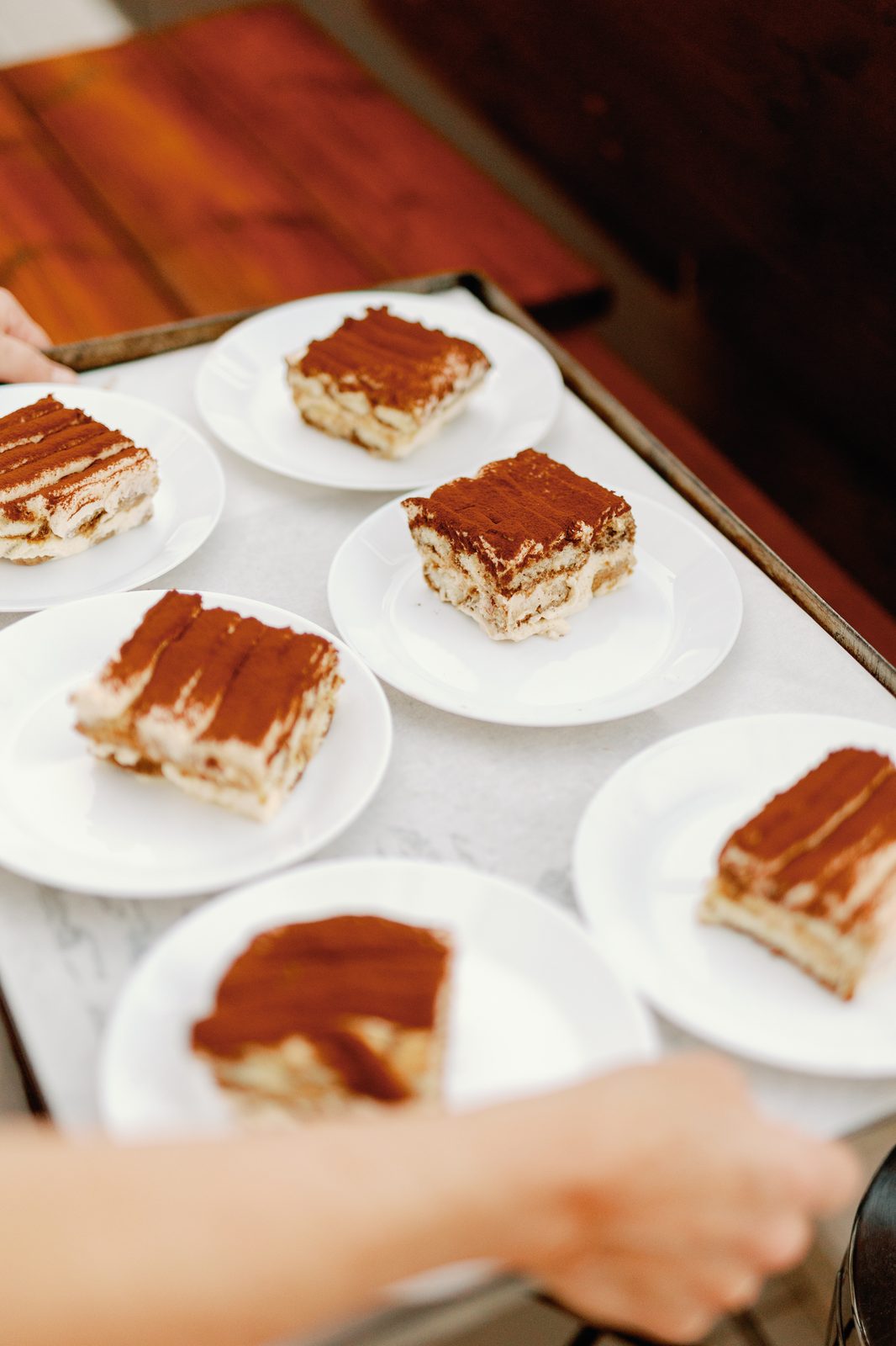 Tray of tiramisu servings ready to be plated