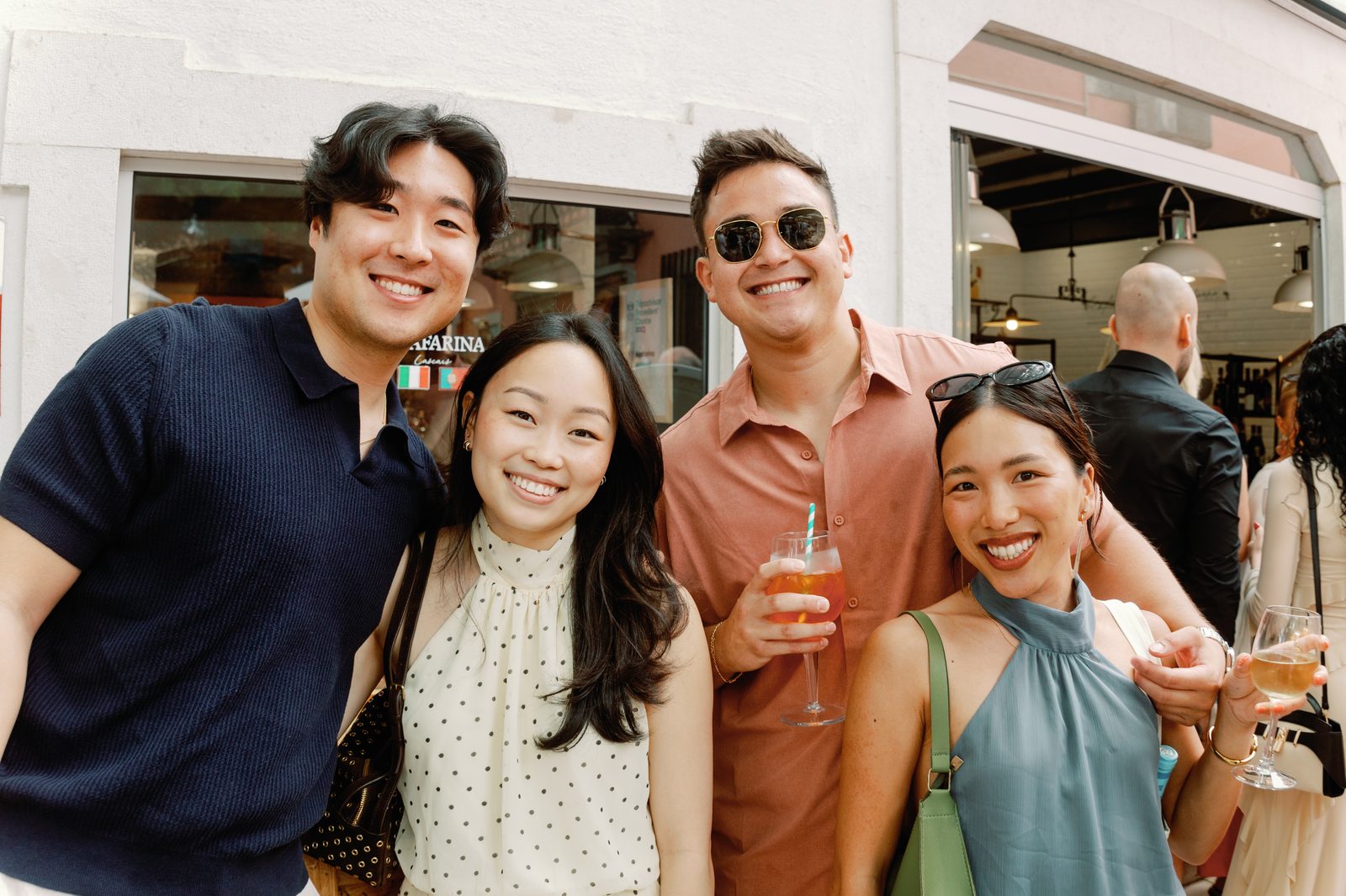 Four friends posing outside Aqafarina Restaurant