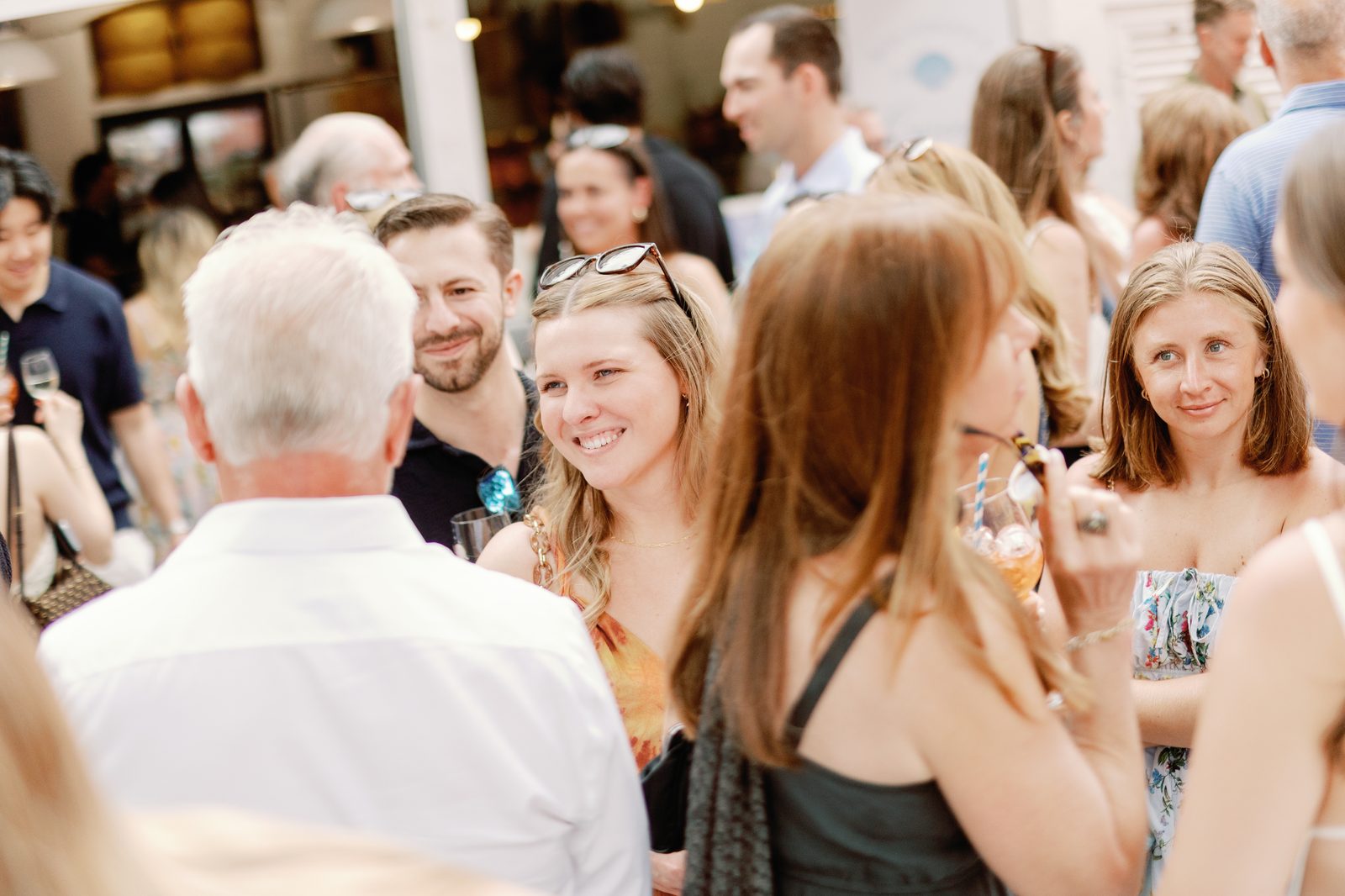 Guest smiling in the crowd