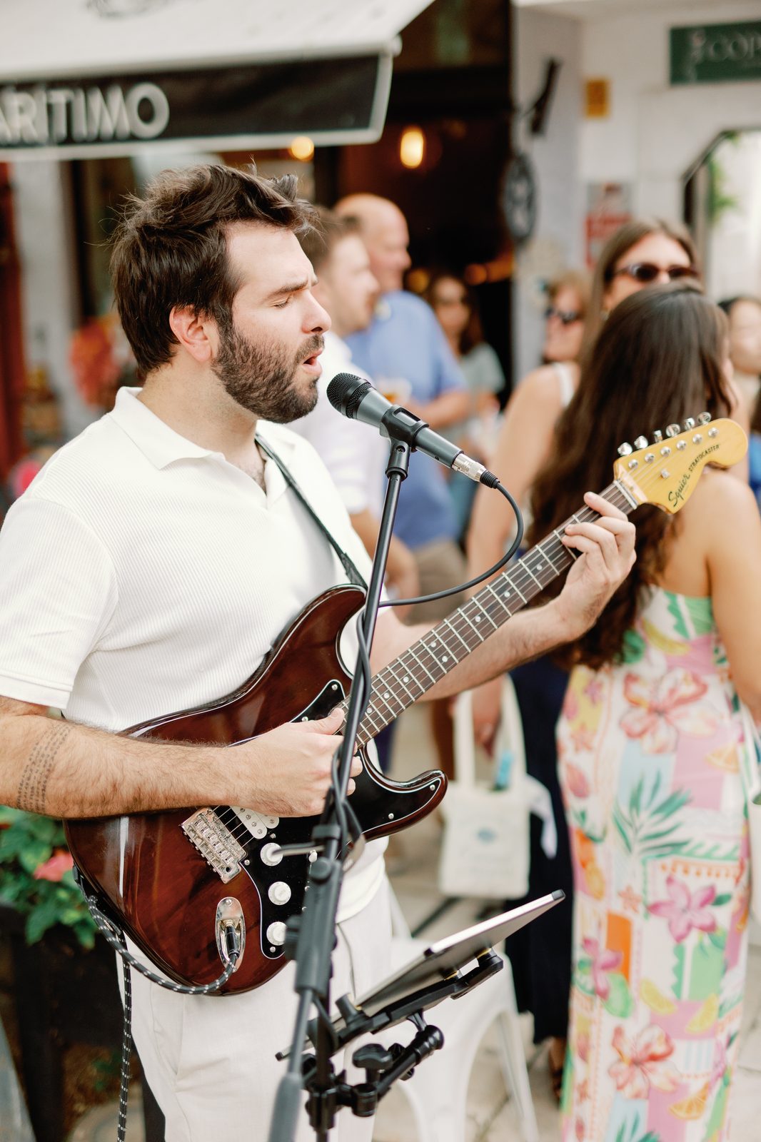 Live guitarist performing for guests