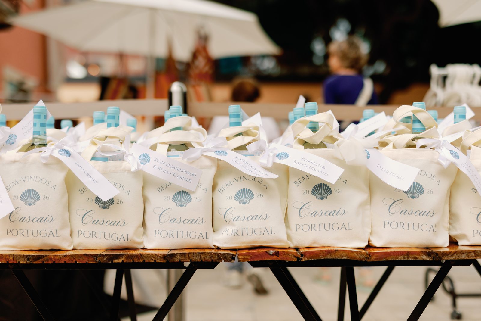 Row of personalized 'Bem-Vindos a Cascais Portugal' welcome bags